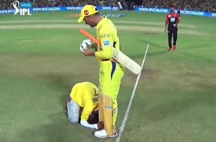 Another fan breaches security to touch the feet of Dhoni