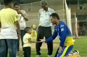 Watch video of Dhoni playing around with a child at Chepauk Stadium