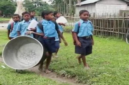 Shocking Video school children crossing the river in aluminium pots