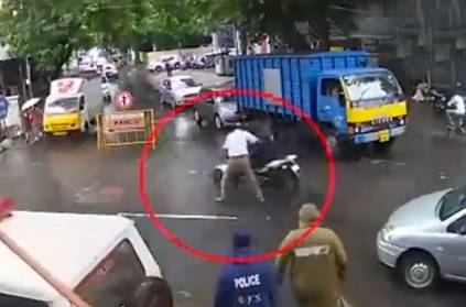 traffic inspector pushing a constable off man\'s bike