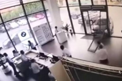 Watch - Woman takes BMW for test drive, crashes into showroom