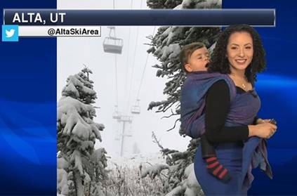 Meteorologist reads weather forecast with son on her back
